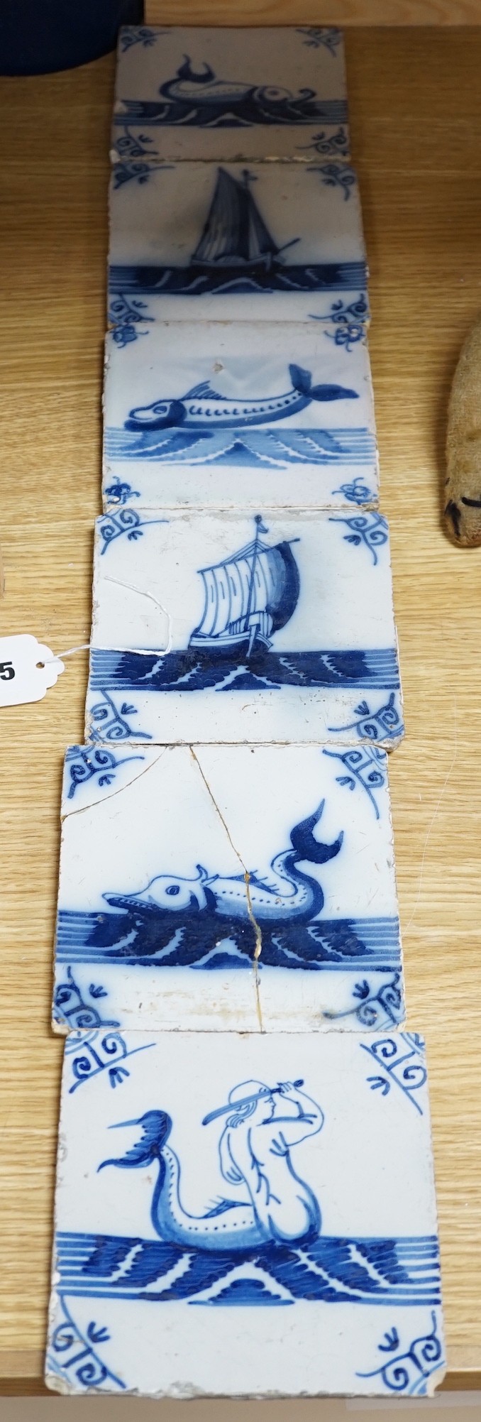 A group of six 18th/19th century blue and white Delft tiles, 13cms square